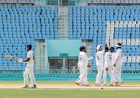 Karnataka players celebrate a Uttarakhand wicket on Day 5 in Lucknow
