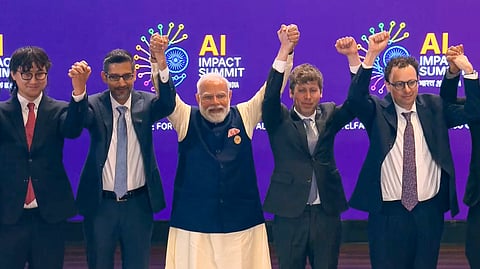 In this screengrab from a video posted on Feb. 19, 2026, Prime Minister Narendra Modi, centre, joins hands with Google CEO Sundar Pichai, OpenAI CEO Sam Altman and others during the India AI Impact Summit 2026, in New Delhi. 