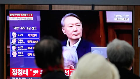 A TV screen shows an image of former South Korea President Yoon Suk Yeol during a news program at the Seoul Railway Station in Seoul, South Korea, Thursday, Feb. 19, 2026.