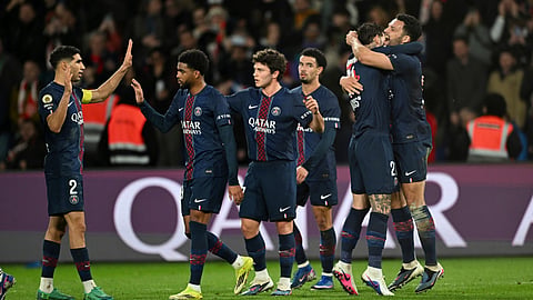 PSG's Goncalo Ramos, right, celebrates with teammates after scoring his side's third goal during the French League One soccer match between Paris Saint-Germain and Metz in Paris, France, Saturday, Feb. 21, 2026. 
