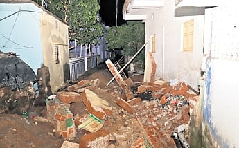 The collapsed boundary wall at Badagada village 