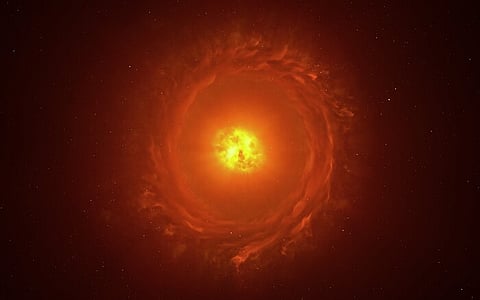 This image shows an artist’s reconstruction of the star WOH G64, the first star outside our galaxy to be imaged in close-up. It is located at a staggering distance of over 160 000 light-years away in the Large Magellanic Cloud. This artistic impression showcases its main features: an egg-shaped cocoon of dust surrounding the star and a ring or torus of dust. The existence and shape of the latter require more observations to be confirmed.