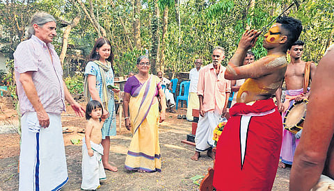 The portuguese family along with local residents during Muthappan Vellattam at Vengara Thekeel Tharavadu Muthappan Podikkalam in Kannur 