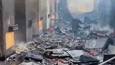 Debris and damaged structures seen after a blast at an explosives manufacturing factory, in Nagpur district, Sunday, Mar. 1, 2026.