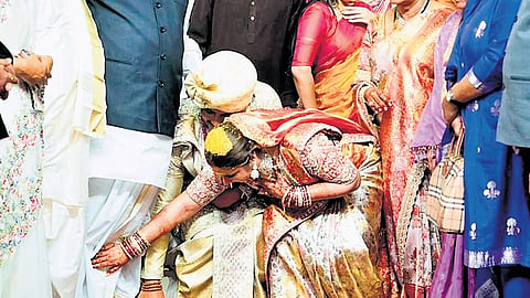 Newly weds Mallu Surya Vikramaditya and Sakshi take the blessings of AICC president Mallikarjun Kharge at GMR Arena in Hyderabad on Thursday.