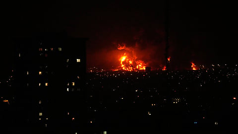 Smoke rises as strikes hit the city during the US–Israeli military campaign in Tehran, Iran, Saturday, March 7, 2026.