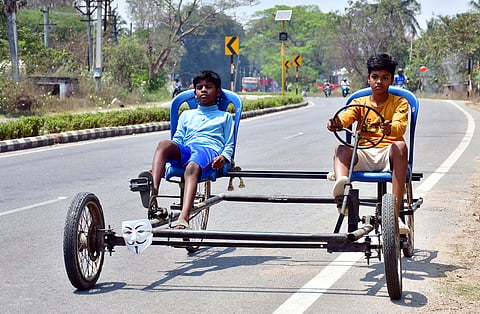 14-year-old K Sabarivasan with his four-wheel cycle 