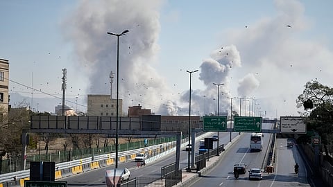 Plumes of smoke rise as strikes hit the city during the U.S.–Israeli military campaign in Tehran, Iran, Thursday, March 5, 2026.