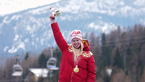 Varvara Voronchikhina, of Russia, smiles on the podium after winning the gold medal in the alpine skiing women's super-G standing at the 2026 Winter Paralympics, in Cortina d'Ampezzo, Italy, Monday, March 9, 2026. 