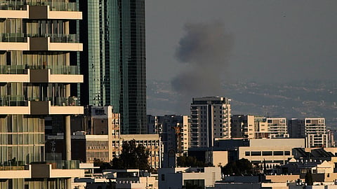 Smoke billows following an Iranian missile attack in central Israel, Monday, March 9, 2026.