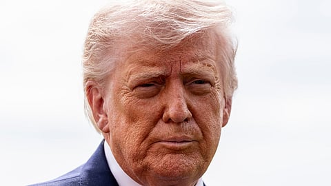 President Donald Trump speaks with reporters before departing on Marine One from the South Lawn of the White House, Wednesday, March 11, 2026, in Washington. 