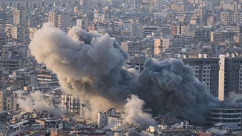 Smoke rises from an Israeli airstrike in Dahiyeh, Beirut's southern suburbs, Lebanon, Tuesday, March 10, 2026. 