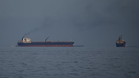 Oil tankers and cargo ships line up in the Strait of Hormuz as seen from Khor Fakkan, United Arab Emirates, Wednesday, March 11, 2026.