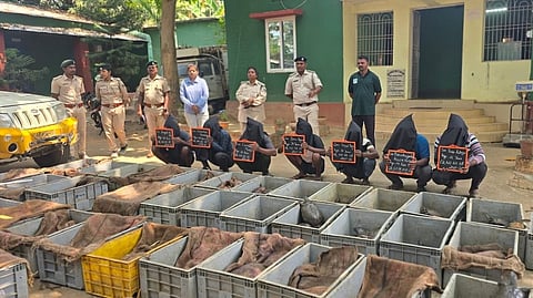 The arrested persons along with the seized materials.
