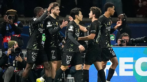 PSG's Khvicha Kvaratskhelia celebrates with teammates after scoring his side's fifth goal during the first leg of the Champions League round of 16 soccer match between PSG and Chelsea, in Paris, Wednesday, March 11, 2026. 