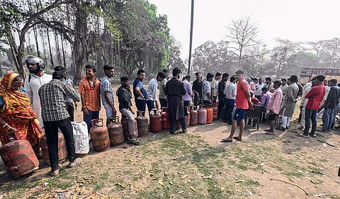 People stand in a queue for LPG cylinders amid an ongoing LPG supply shortage, in Patna on Friday. (Representative  Image)