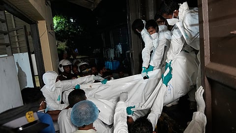 Healthcare workers unload from a vehicle the bodies of Iranian sailors who died when their IRIS Dena warship sank outside Sri Lanka's territorial waters, in Galle, Sri Lanka, Wednesday, March 4, 2026. 