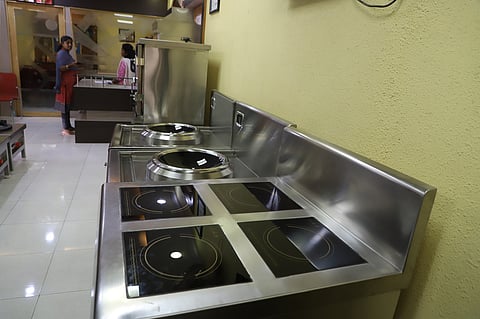 Workers busy making commercial Induction kitchen equipments. Image used for representational purposes only.