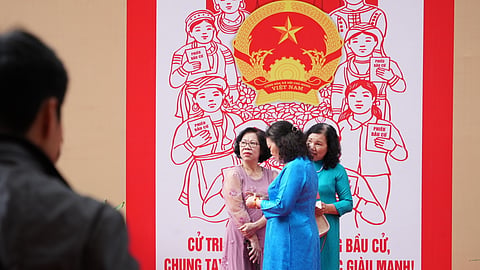 Voters wait to cast ballots to elect representatives in the National Assembly and people's councils in Hanoi, Vietnam, Sunday, March 15, 2026.