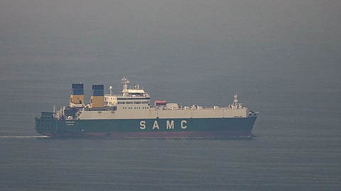 A cargo ship sails in the Arabian Gulf towards the Strait of Hormuz in the United Arab Emirates, Sunday, March 15, 2026.