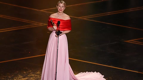 Jessie Buckley accepts the award for actress in a leading role for "Hamnet" during the Oscars on Sunday, March 15, 2026, at the Dolby Theatre in Los Angeles. 