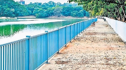 A walkway under construction at Ulsoor Lake.