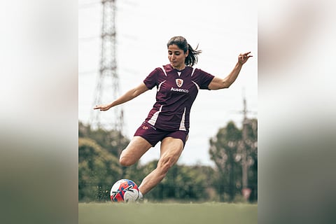 Iranian soccer player Atefeh Ramezanisadeh kicks a ball at a Brisbane Roar club training session in Brisbane, Australia, Monday, March 16, 2026. 