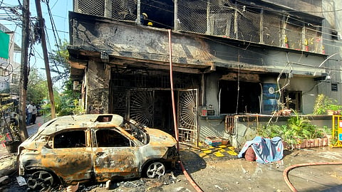 Rescue operations underway as a fire broke out in a house, in Indore, Madhya Pradesh, Wednesday, March 18, 2026. Eight people were killed in the incident, officials said.