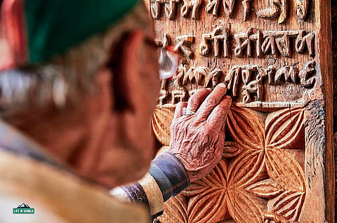 A wooden panel with Tankri script