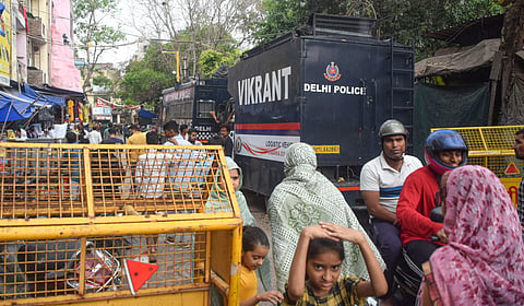  Police vehicles and barricades deployed as part of security arrangements ahead of Eid al-Fitr, at Uttam Nagar, in New Delhi, Thursday, March 19, 2026. As per the officials, tension prevails in the area following murder case of Tarun.