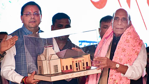 Defense Minister Rajnath Singh being presented a miniature of Nanda Devi Temple by Uttarakhand Chief Minister Pushkar Singh Dhami during a public rally 