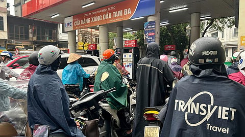 Motorcycle riders wait at a gas station in Hanoi, Vietnam Monday, March 9, 2026. 