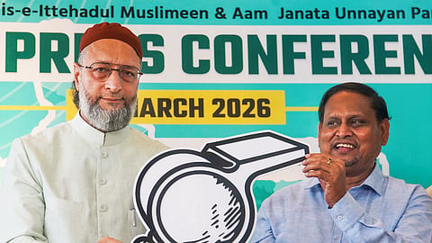 All India Majlis-e-Ittehadul Muslimeen (AIMIM) President Asaduddin Owaisi, left, and Aam Janata Unnayan Party (AJUP) Chief Humayun Kabir release their alliance symbol during a press conference, in Kolkata, Wednesday, March 25, 2026. 