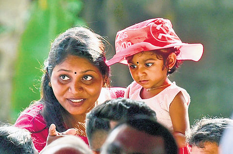 A mother tries to draw her child’s attention to Chief Minister Pinarayi Vijayan during the election campaign of LDF’s Tripunithura candidate K N Unnikrishnan 