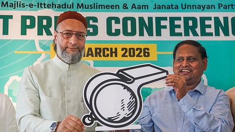 All India Majlis-e-Ittehadul Muslimeen (AIMIM) President Asaduddin Owaisi, left, and Aam Janata Unnayan Party (AJUP) Chief Humayun Kabir release their alliance symbol during a press conference, in Kolkata, Wednesday, March 25, 2026