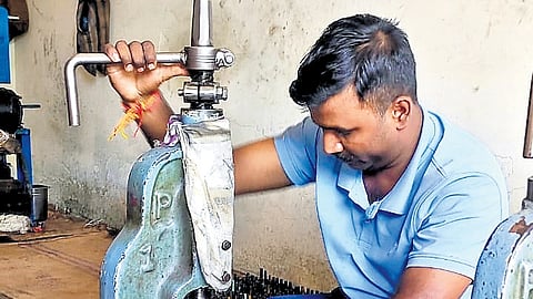 A worker engaged in anklet manufacturing work at a unit in Salem 