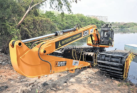 The newly deployed long-reach excavator in operation along the Hussainsagar in Hyderabad on Monday 