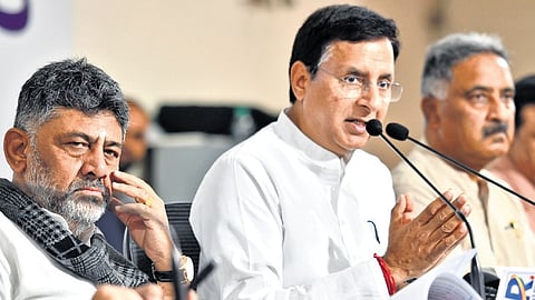 AICC General Secretary Rajdeep Singh Surjewala addresses the media at the KPCC office in Bengaluru on Tuesday. DCM DK Shivakumar looks on. 