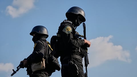 Iranian police special forces stand guard during a funeral procession for Alireza Tangsiri, head of Iran's Islamic Revolutionary Guard Corps Navy, and others killed in Israeli strikes in late March, in Tehran, Iran, Wednesday, April 1, 2026. 