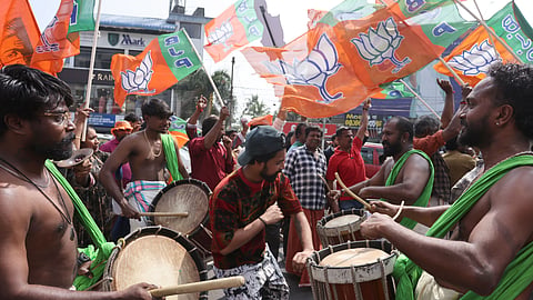 Jubilant NDA workers celebrate their victory in Thiruvananthapuram Corporation in front of  the counting center at Mar Ivanios College on Saturday.
