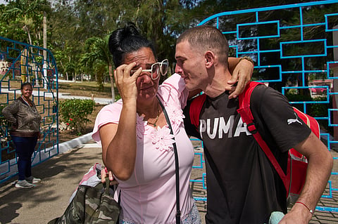 A pardoned prisoner hugs a family member after being released from La Lima penitentiary in Guanabacoa, Havana, Cuba, Friday, April 3, 2026