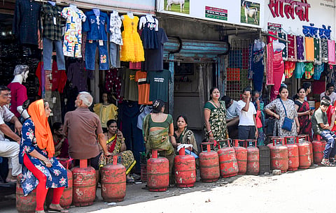 People wait in a queue to refill LPG cylinders amid disruptions due to the ongoing West Asia war, in Mumbai, Maharashtra, Saturday, April 4, 2026. 