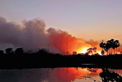 Smoke billows from burning garbage 
at Chandanapalli in Nalgonda