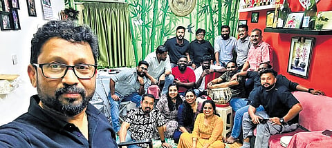 Members of Kala Kuwait behind the viral parody; lyricist Shebin (in a black T-shirt, seated at the right corner) and lead singer Sandeep (in a red T-shirt). 