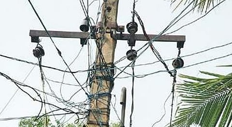 According to sources, K Dinakaran (32) was working on electric poles near Memathur when he came into contact with the power line. 