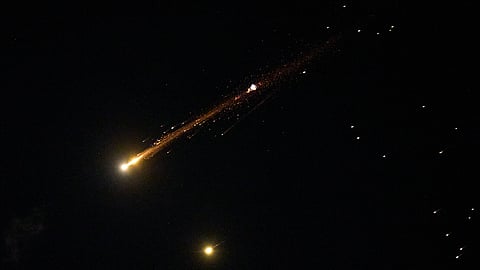 An Iranian cluster munition missile explodes in the sky over northern Israel, Wednesday, April 8, 2026. 
