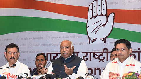 Congress President and Rajya Sabha Leader of Opposition Mallikarjun Kharge, centre, addresses a press conference ahead of the Assam Legislative Assembly Election, in Guwahati, Assam, Tuesday, April 7, 2026.