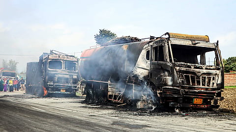 Charred remains of trucks following a protest over the killing of two toddlers in an alleged bomb attack on the night of April 6 in Bishnupur. 