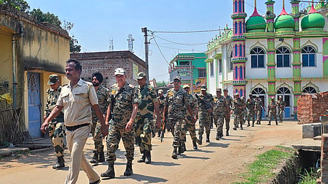 : Security officials conduct a route march as part of a voter awareness initiative ahead of the West Bengal Assembly elections, in Birbhum, Wednesday, April 8, 2026. 
