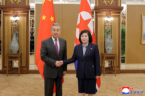 This picture taken on April 9, 2026 and released by North Korea's official Korean Central News Agency (KCNA) on April 10, 2026 shows Chinese Foreign Minister Wang Yi (L) shaking hands with North Korean Foreign Minister Choe Son Hui at the Geumsusan Guesthouse in Pyongyang. 